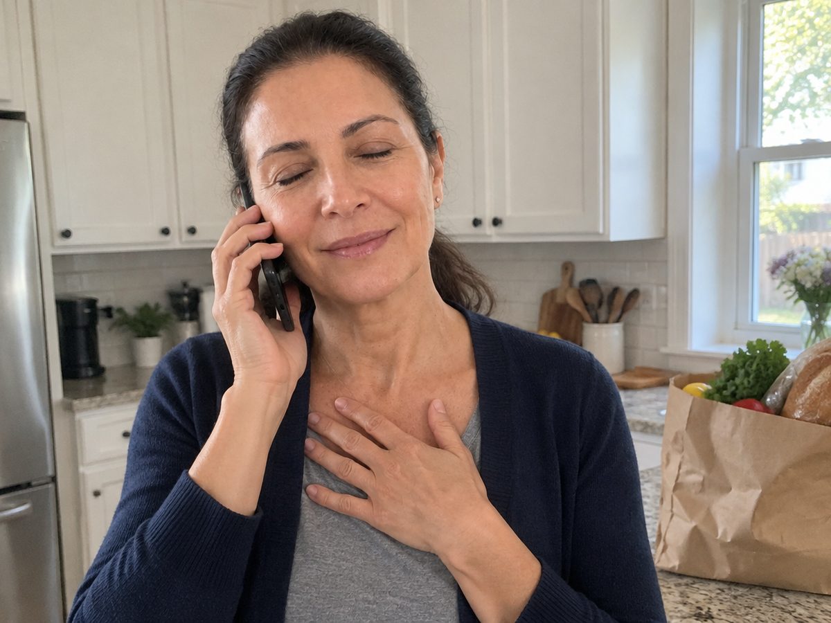 The founder in her kitchen on the phone, hand on her heart